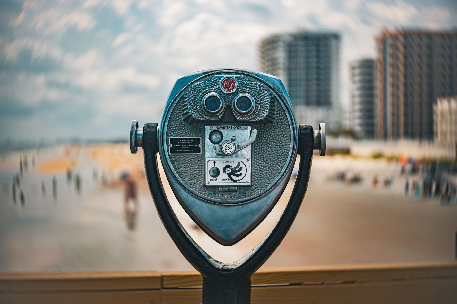 Coin-operated viewer overlooking the sandy beaches and skyline of Daytona Beach, Florida.